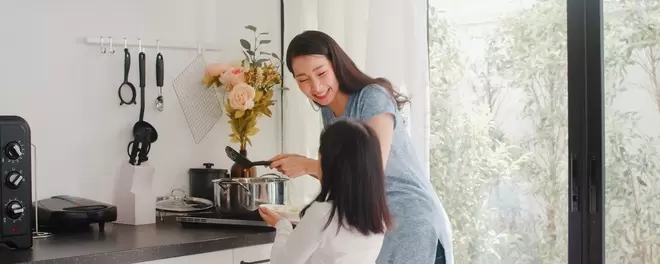 young_asian_japanese_mom_daughter_cooking_home_lifestyle_women_happy_making_pasta_spaghetti_together_breakfast_meal_modern_kitchen_house_morning